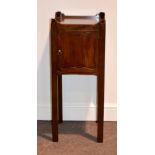 A George III mahogany night table, of small proportions, with raised gallery, panelled door,