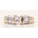 A diamond ring, Princess cut stone, four-claw set, in an 18ct white gold mount,