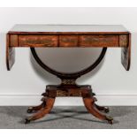 A Regency rosewood and brass inlaid sofa table, with ornamental inlaid scroll work, D shape flaps,