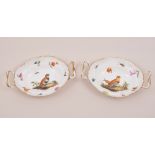 A pair of Berlin oval sweet meat dishes, KPM, probably late 19th Century, each painted with a bird,