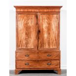 A George IV mahogany press cupboard, ogee moulded cornice, plain frieze,