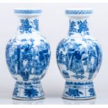 A pair of Chinese blue and white baluster shape vases, bearing Kangxi six character marks,