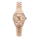 A lady's Rolex Oyster Perpetual Datejust wristwatch, champagne dial with diamond points,