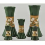 Two pairs of lead glazed vases, and another similar, (5).