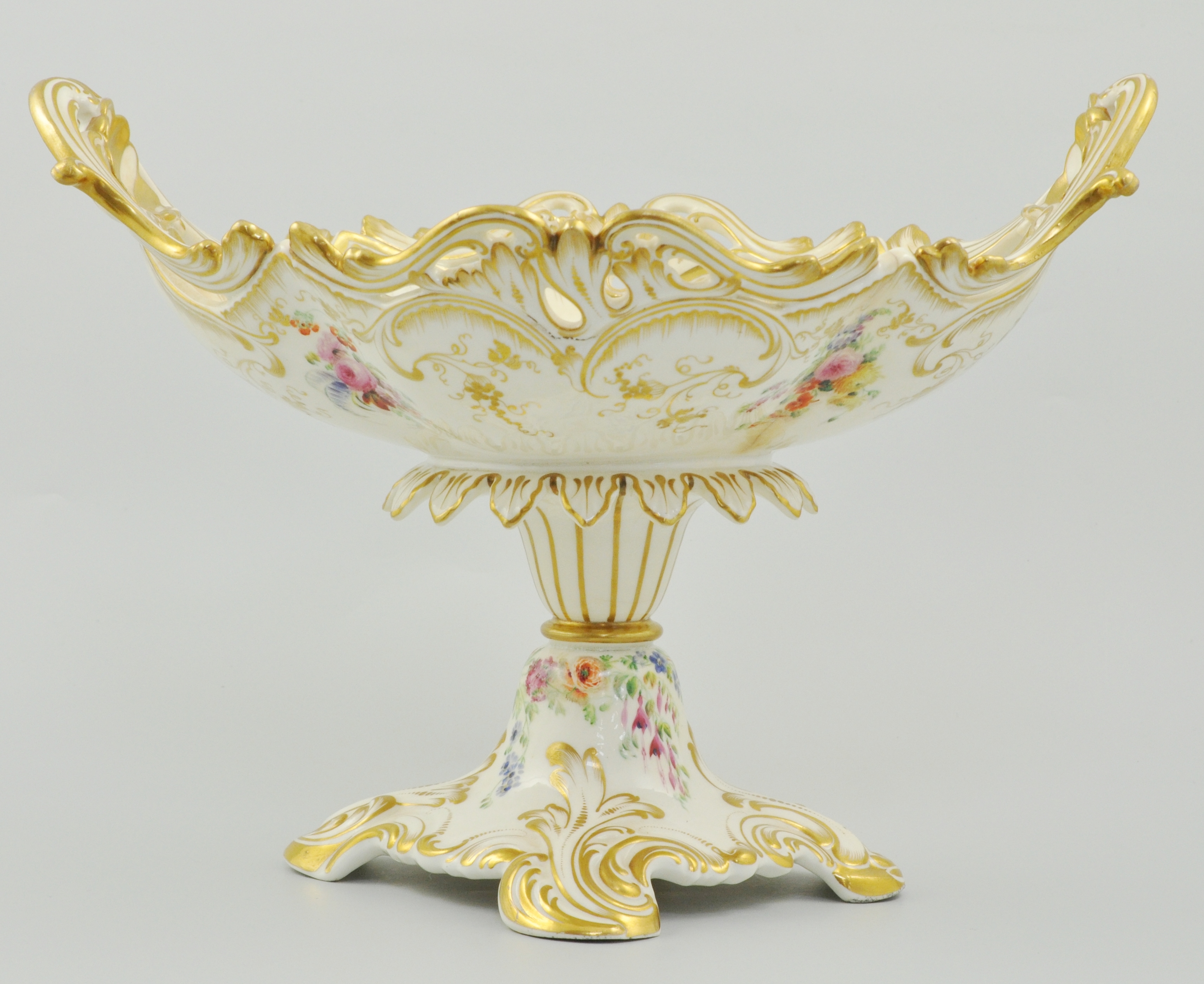 Rockingham style comport, florally decorated, with a stylised gilt border, height 21cm.