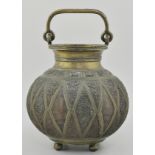 Islamic Indo Persian bronze vessel, with elaborately engraved detailing, sat on four ball feet,