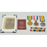 Medals: WW1 trio to 85951.GNR.E.CARTER R.F.A together with a picture an identity card.