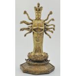 Chinese bronze figure of a multi armed Buddha, on a lotus and hexagonal base, traces of gilt,