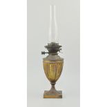 Oxidised brass oil lamp, urn shape with a chimney, 58cm overall.