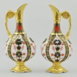 Pair of Royal Crown Derby china "Imari" pattern ewers, each with flattened ovular body,