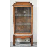 Oak display cabinet, glazed panel with end opening doors, enclosing plate glass shelves,