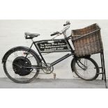 Motorised bicycle, with a bread basket.