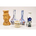 Staffordshire treacle glazed character jug - "Ally Sloper", 17cms, a pair of ironstone bottle vases,