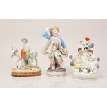 Pair of Continental figures of a boy and girl carrying grape hods with gathered flowers, 21cm,