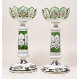 Pair of opaque overlaid green glass lustre vases, lacking prismatic drops, floral decoration, 33cm.