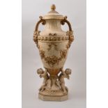 Parcel gilt cast plaster ornamental urn, modelled with cherubs, 57cm.