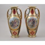 Pair of Viennese two handled vases, fitted reserves with classical scenes, 36cm.