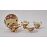 Four Aynsley cups and saucers, painted decoration of fruit, similar milk jug,