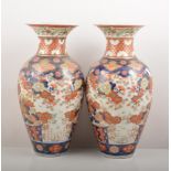 Pair of Imari baluster shaped vases, floral decoration in a typical palette, 38cm.