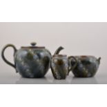 Three piece Royal Doulton stoneware tea set, moulded decoration on a mottled olive ground no.