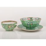 Chinese porcelain tea set, decorated with butterflies on a leafy green ground.