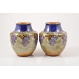 Doulton Lambeth, a pair of stoneware vases, circa 1910,