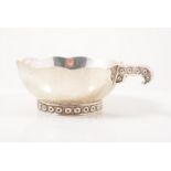 A Mexican sterling silver handled bowl, wavy rim,