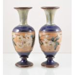 Doulton Lambeth, a pair of Slaters stoneware vases, circa 1900, baluster form white blossom fields,