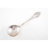 Christian Heise, a large Danish white metal serving spoon, 1923, martele finish,