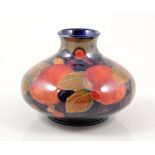 William Moorcroft, a 'Pomegranate' vase, circa 1920, squat form, factory marks, blue signature,