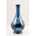 William Moorcroft, a 'Moonlit Blue' vase, circa 1925, bottle form, factory marks, green initials,