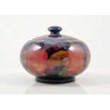 William Moorcroft, a 'Pomegranate' lidded pot, circa 1920, swollen form, factory marks,