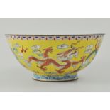 Chinese enamelled bowl, imperial yellow ground, decorated with stylised dragons and clouds,