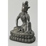Chinese bronze figure of a seated Buddha, with foliate crown and left hand to chin,
