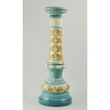 English pottery column/jardinière stand, stylised floral decoration to a turquoise ground, unmarked,