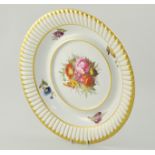 Large Derby charger, circa 1810, decorated with a floral bouquet to centre,