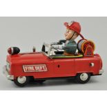 Japanese tin plate clockwork style fire department car, battery operated.