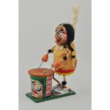 Tin plate and plastic battery operated model of a North American Indian Drummer.