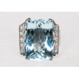A large aquamarine and diamond dress ring,