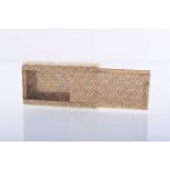 An 18ct gold three-colour pill box, marked 750, woven design with sliding lid, 21grms, 4.5cms.