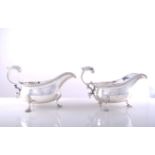 A pair of George III style silver sauceboats, by C G Vander, London 1909, gadrooned outlines,