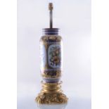 A Second Empire style porcelain and gilt metal lamp base, a vase shape body,