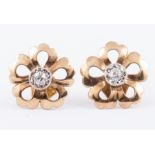 A pair of yellow metal floral stud earrings,