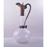 A Victorian cut glass and silver mounted claret jug, by Cartwright and Woodward, Birmingham 1862,