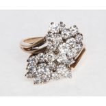 A diamond set dress ring, of cross-over design with diamonds, (29),