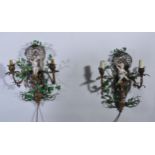 A pair of rococo style gilt metal two branch wall lights, modelled with Dresden porcelain cherubs,