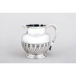 A George IV silver ovoid jug, by T Cox Savory, London 1829, moulded outlines, semi gadrooned bowl,