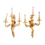 A pair of French gilt metal three-light wall brackets, second half of the 19th Century,