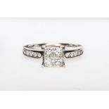 A square diamond cluster ring, four Princess cut diamonds square set to centre with diamonds (5),
