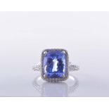 A tanzanite and diamond rectangular shaped cluster ring,